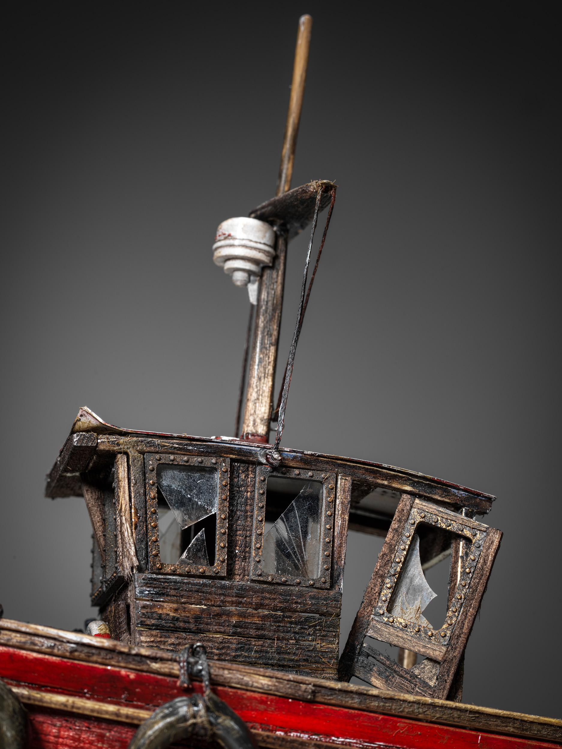 Broken wheelhouse glazing and a detached timber door on Mollie